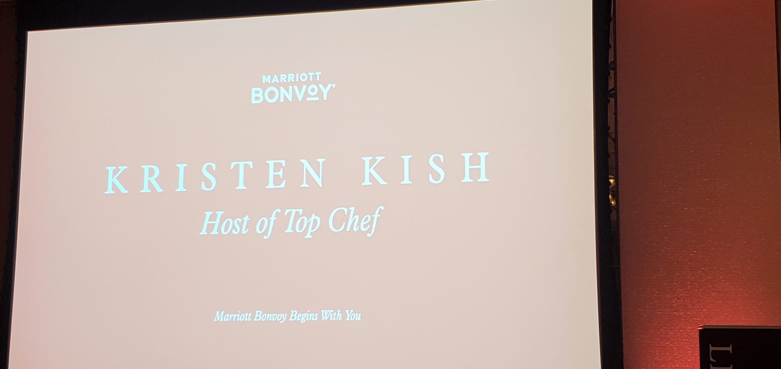 Kristen Kish Host of Top Chef title screen on the ballroom projection display