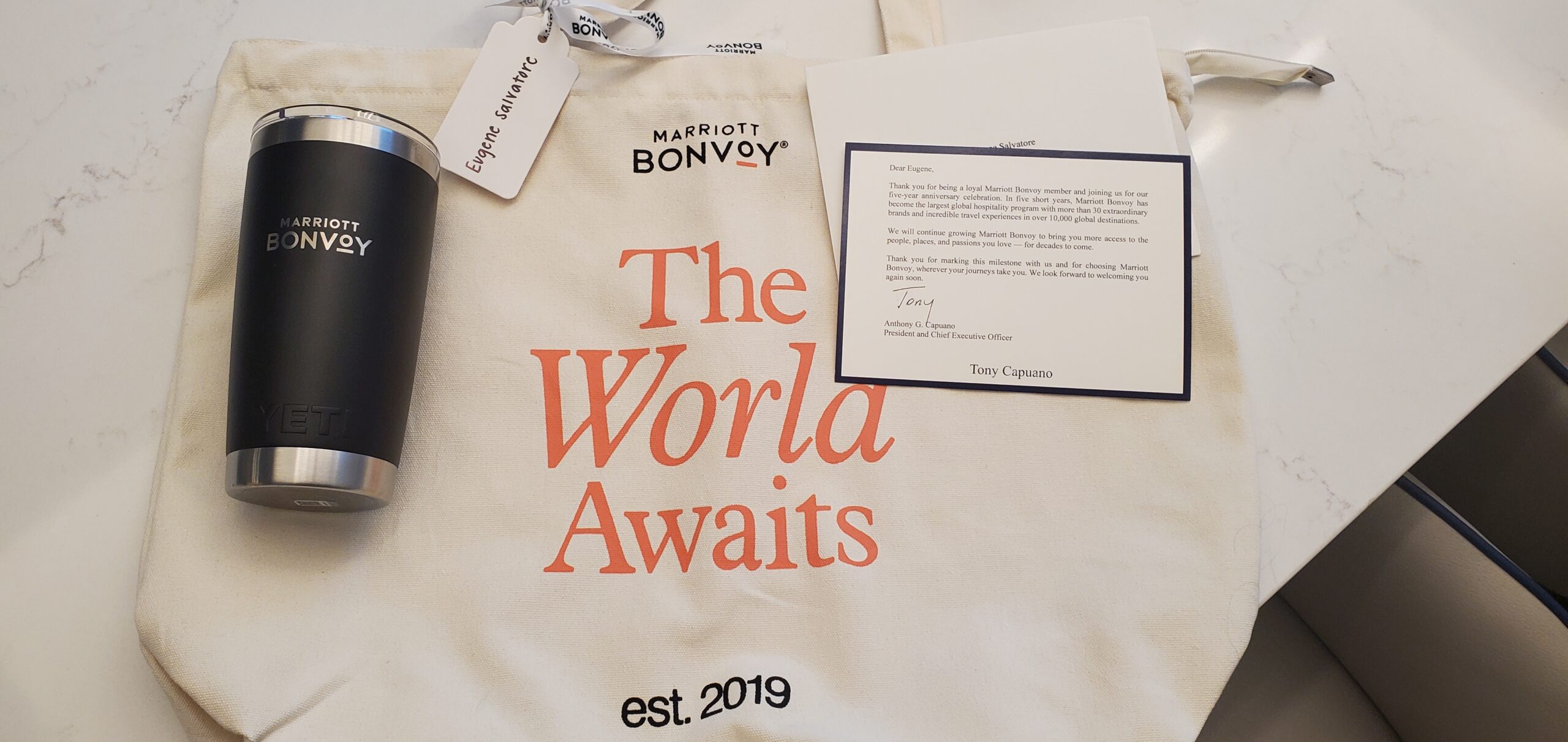 Commemorative SWAG package including custom tote bag, Bonvoy Yeti tumbler, and Tony Capuano letter