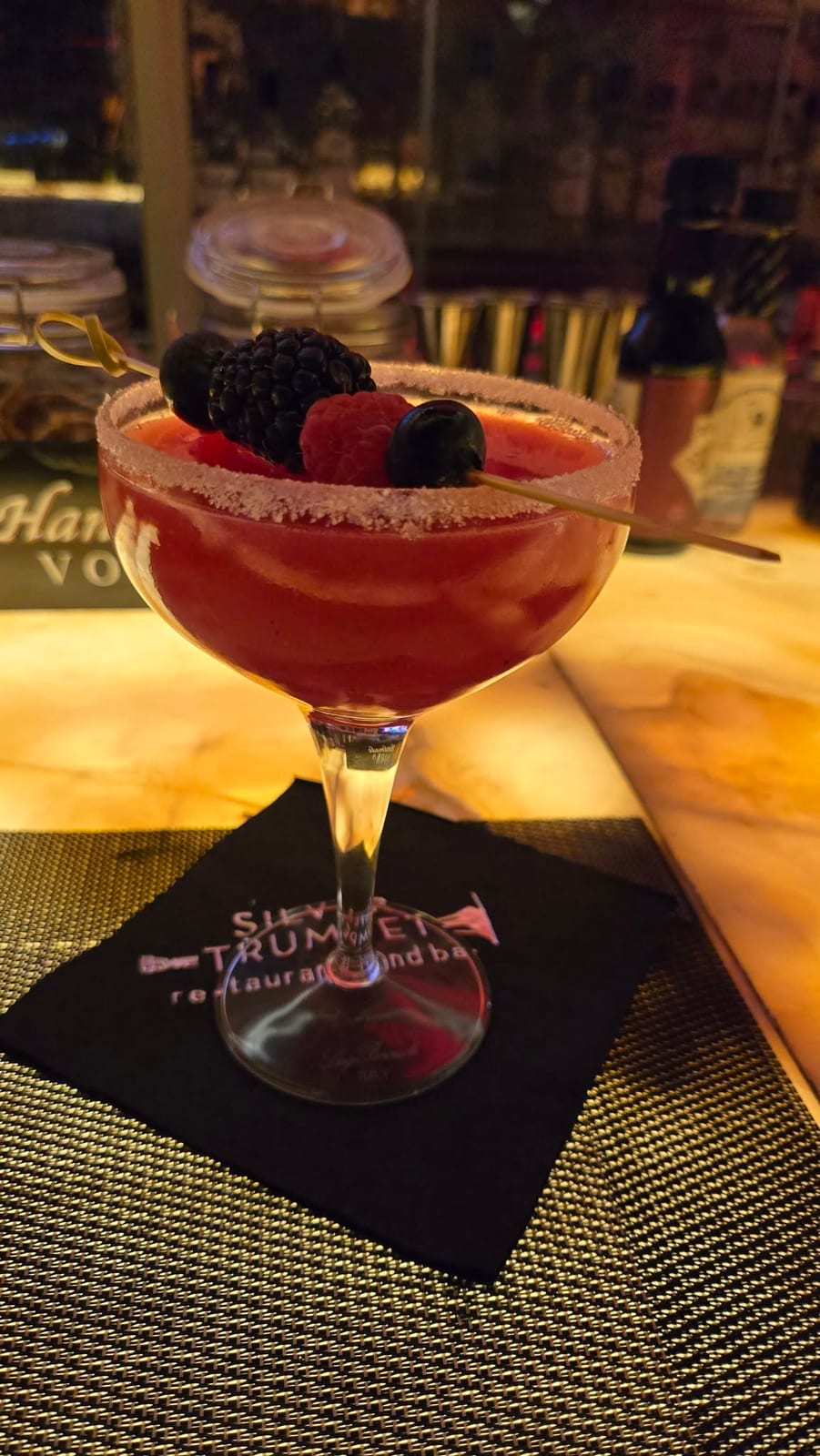Silver Trumpet Bar Handcrafted Fresh Berry Cocktail with Sugared Rim