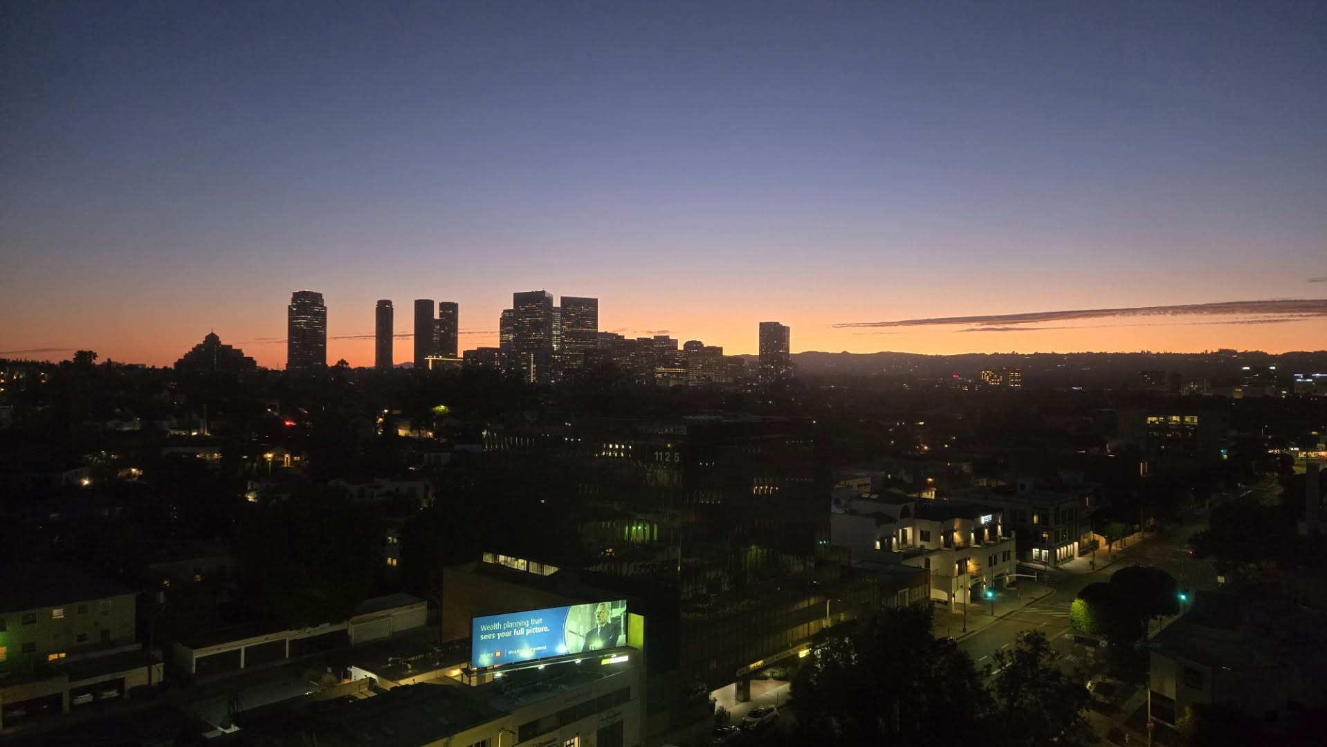 Dusk skyline view of Century City towers from the 12th floor suite
