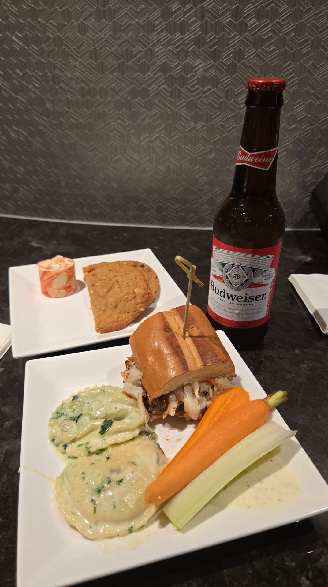 M Club evening plate: Pulled pork slider, cheese ravioli, cookies, and Budweiser