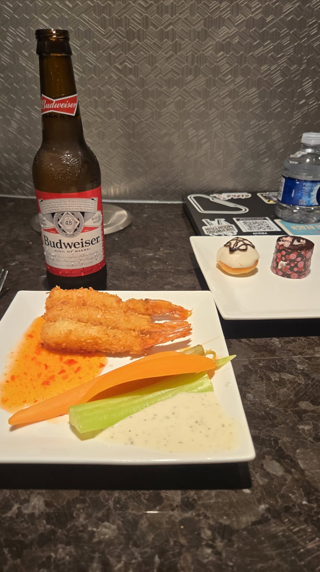 Crispy fried shrimp with sweet chili sauce, fresh vegetables, dessert petits fours, and Budweiser
