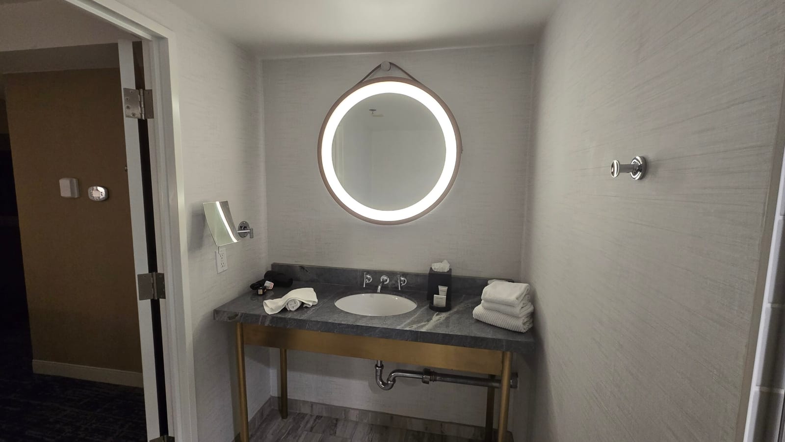 Hotel Dena Dena Suite bathroom vanity with illuminated ring mirror
