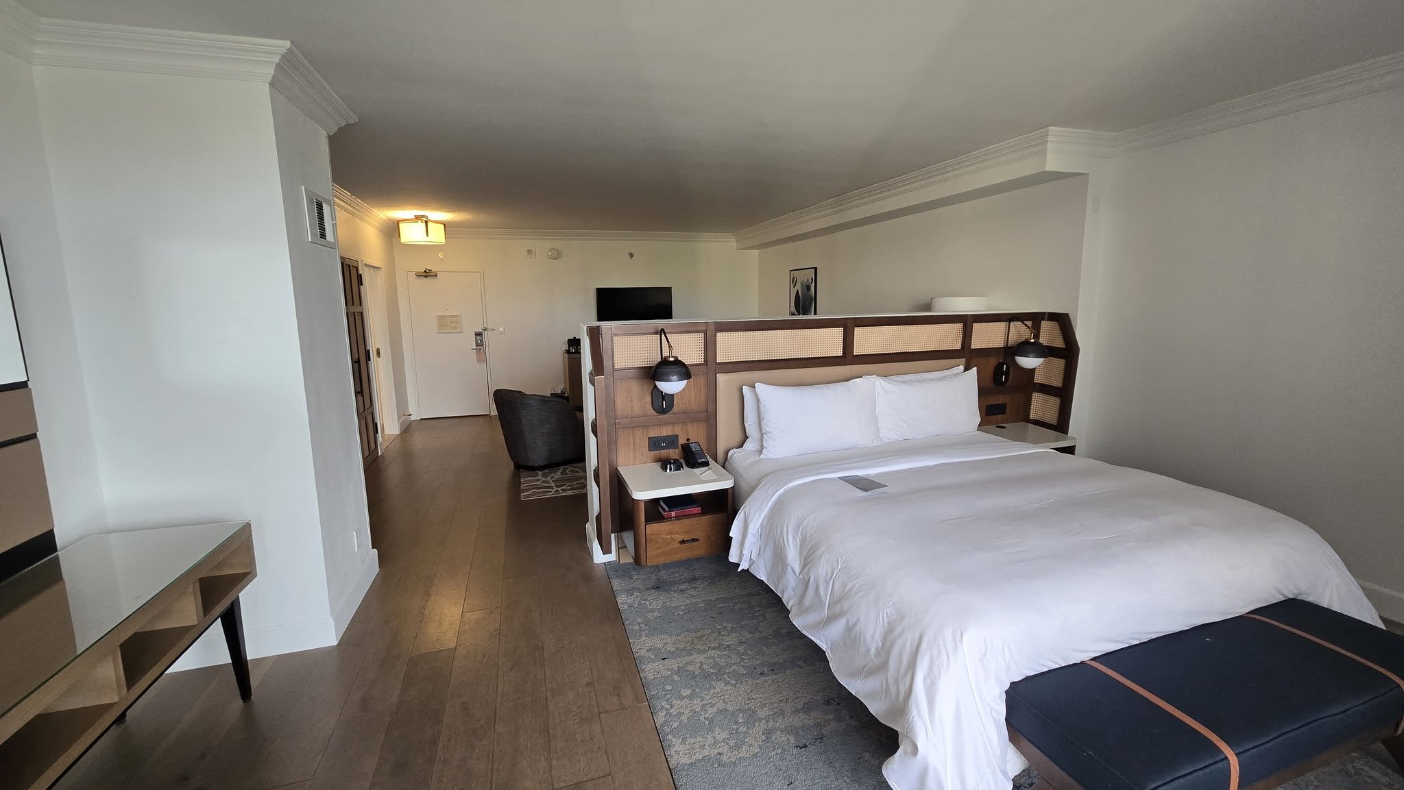 Master bedroom angle showing the cane divider wall and parlor pathway