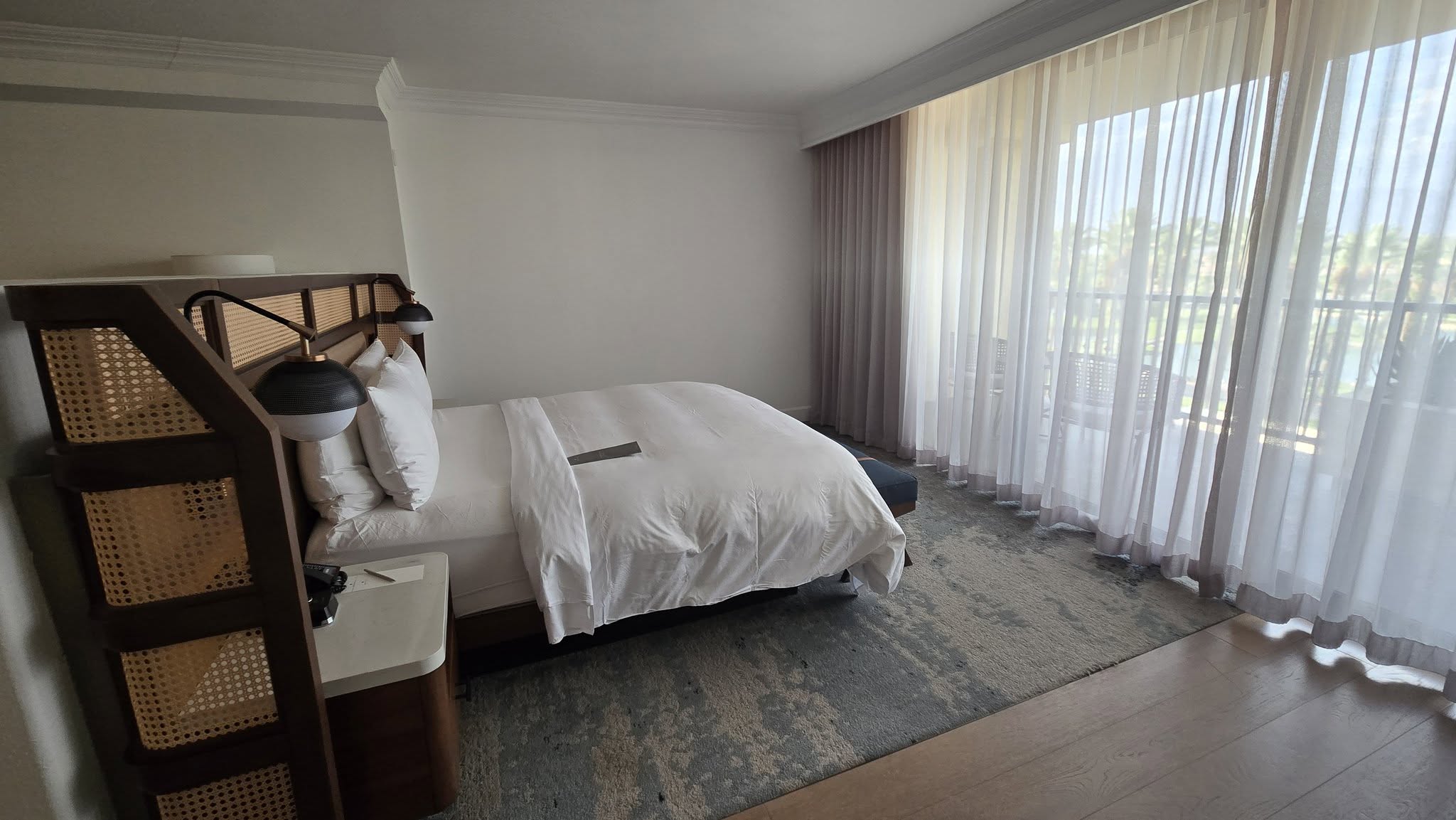 Master King bed with custom woven cane headboard divider wall