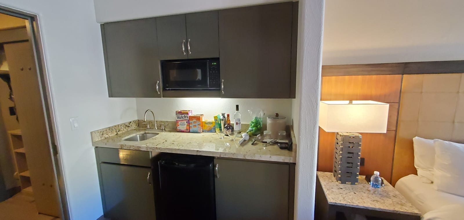 Kitchenette bar station fully stocked with cocktail essentials