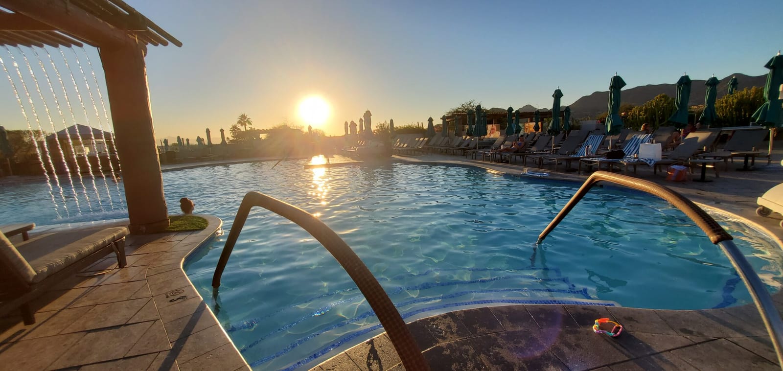 Jackrabbit Pool at golden sunset with cascading water curtain