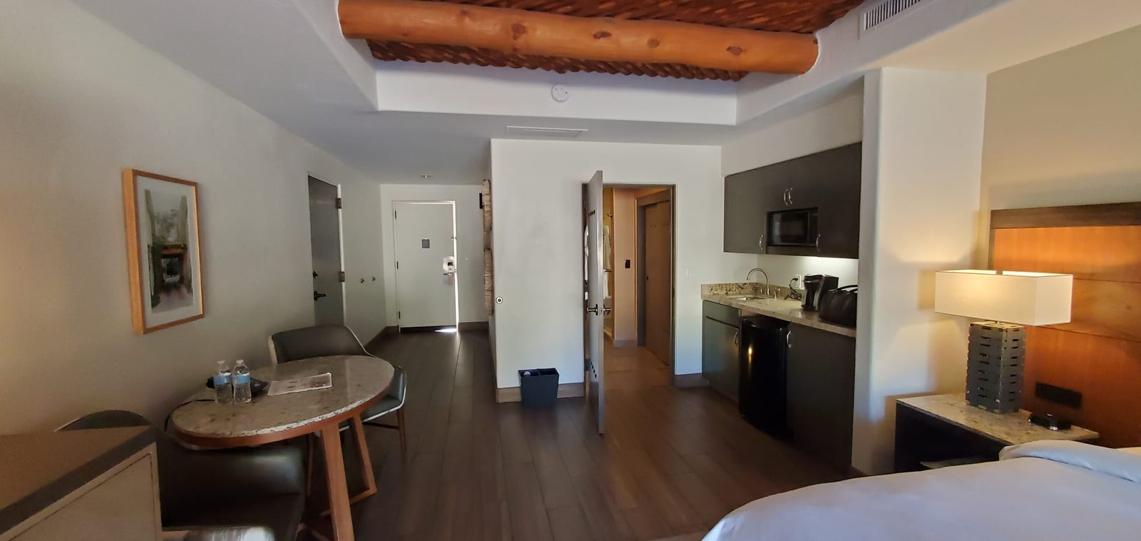 Signature Casita interior panorama with authentic viga and latilla wood ceiling