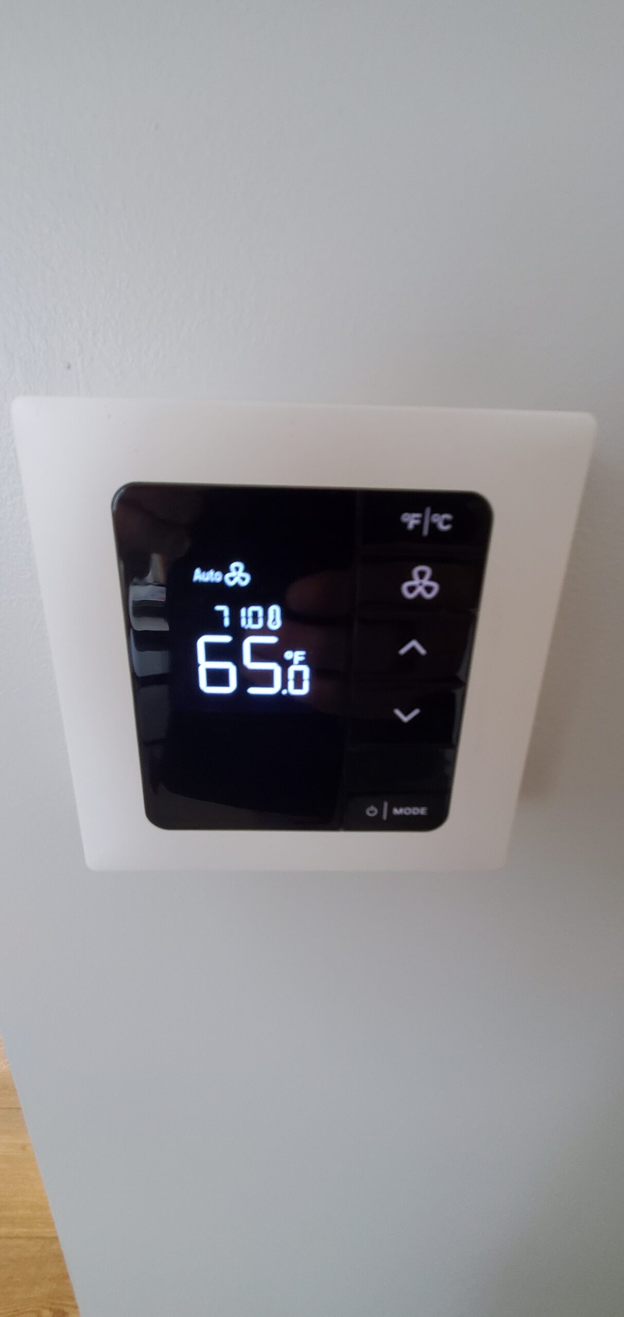 Digital thermostat in Corner Suite 732 showing 65°F setpoint and 71°F ambient room temperature