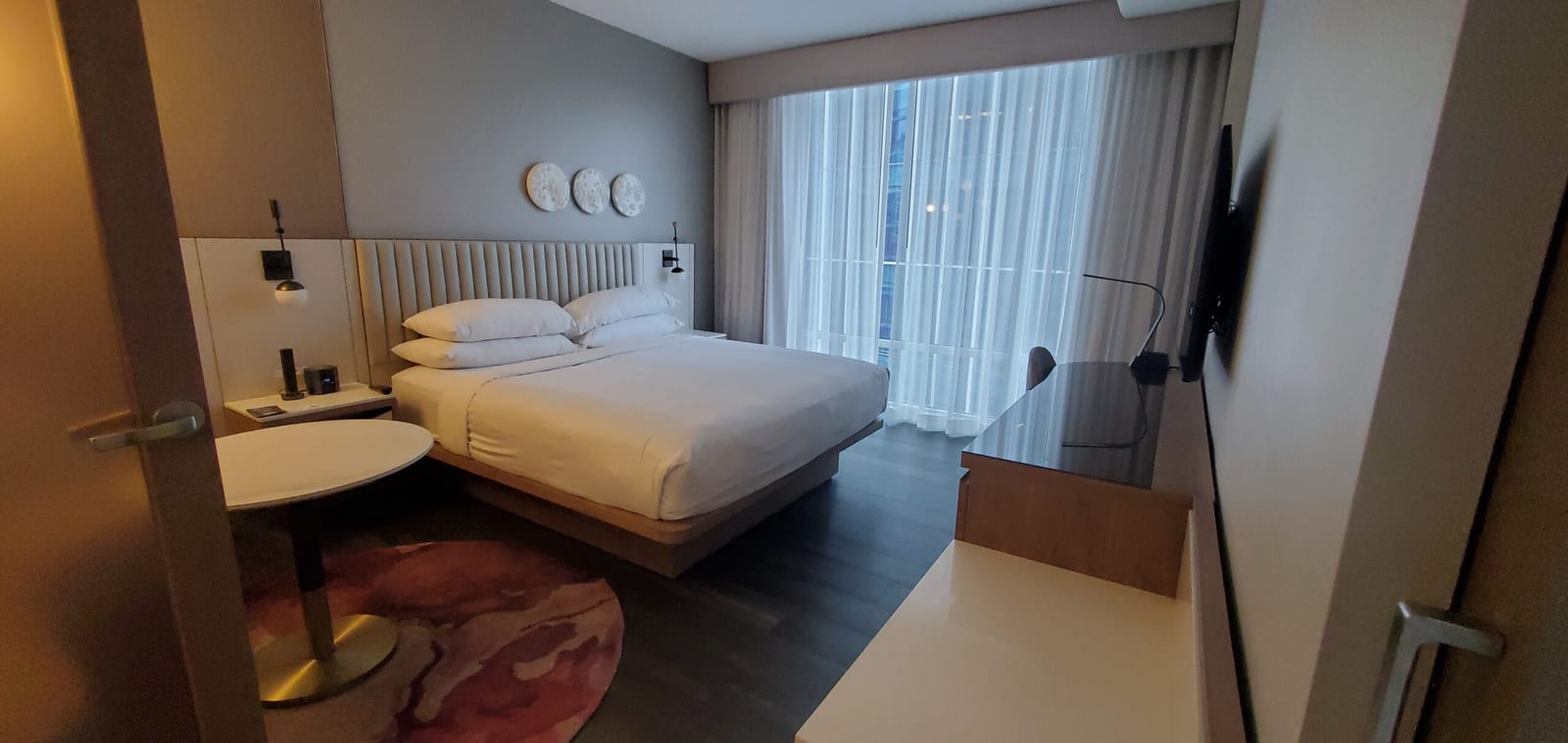 Room 732 King bedroom architectural lighting and floor-to-ceiling glass