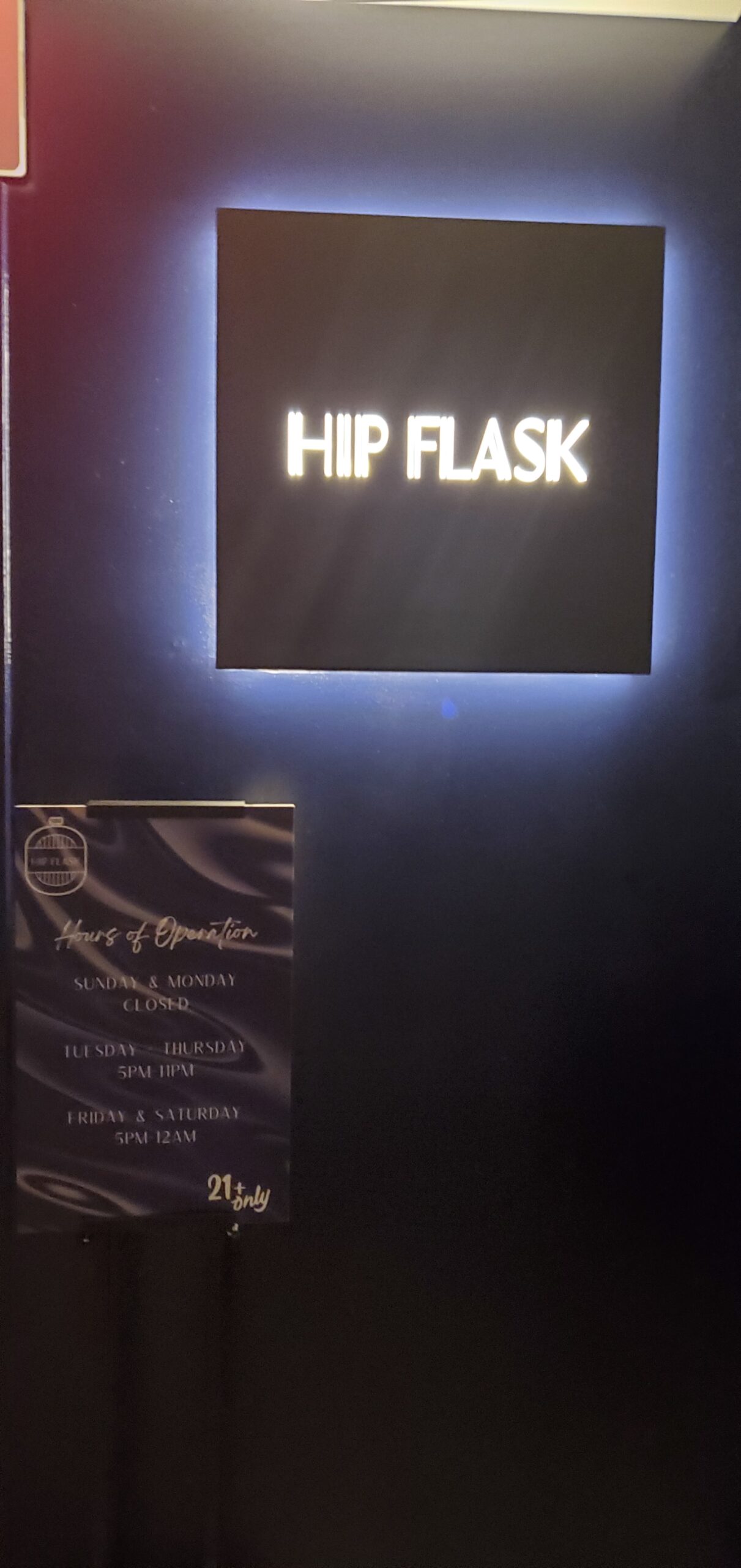 Hip Flask rooftop bar entrance sign on the 13th floor