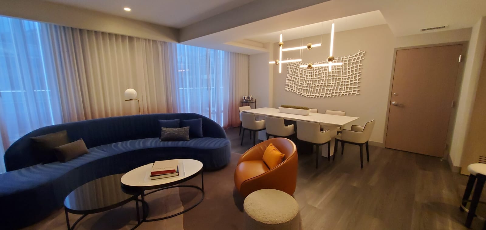 Presidential Suite conference and dining table seating eight guests