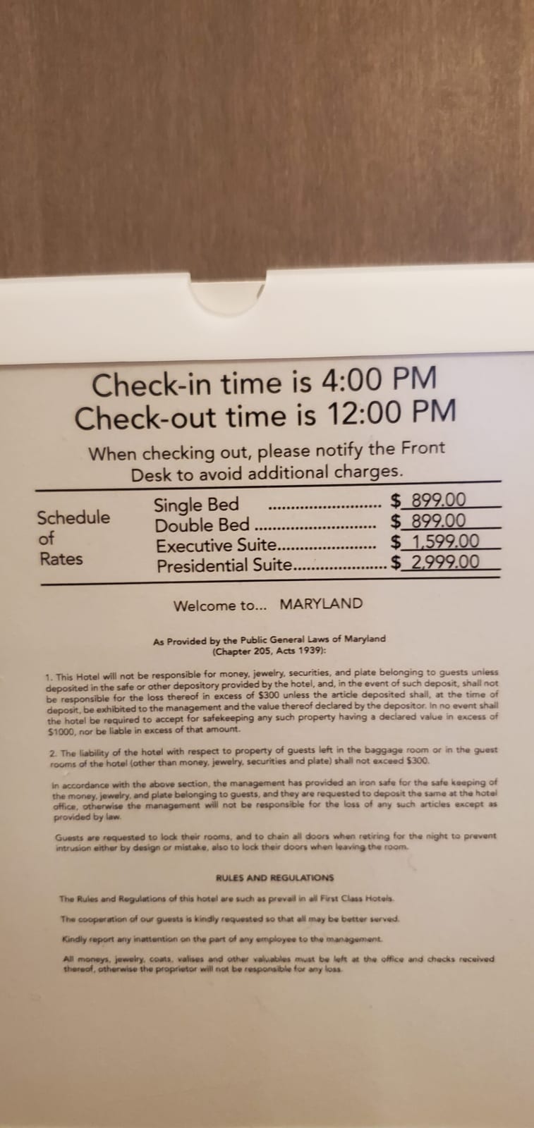 Room 1224 door placard and schedule of rates verifying $2,999.00 rack rate