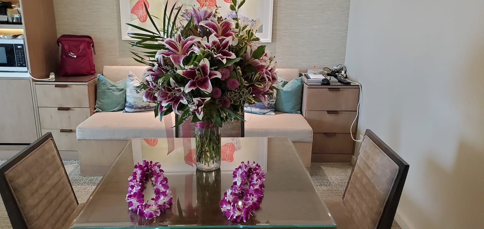 Friend's Welcome Floral Arrangement and Orchid Leis in Ohana Suite Dining Room